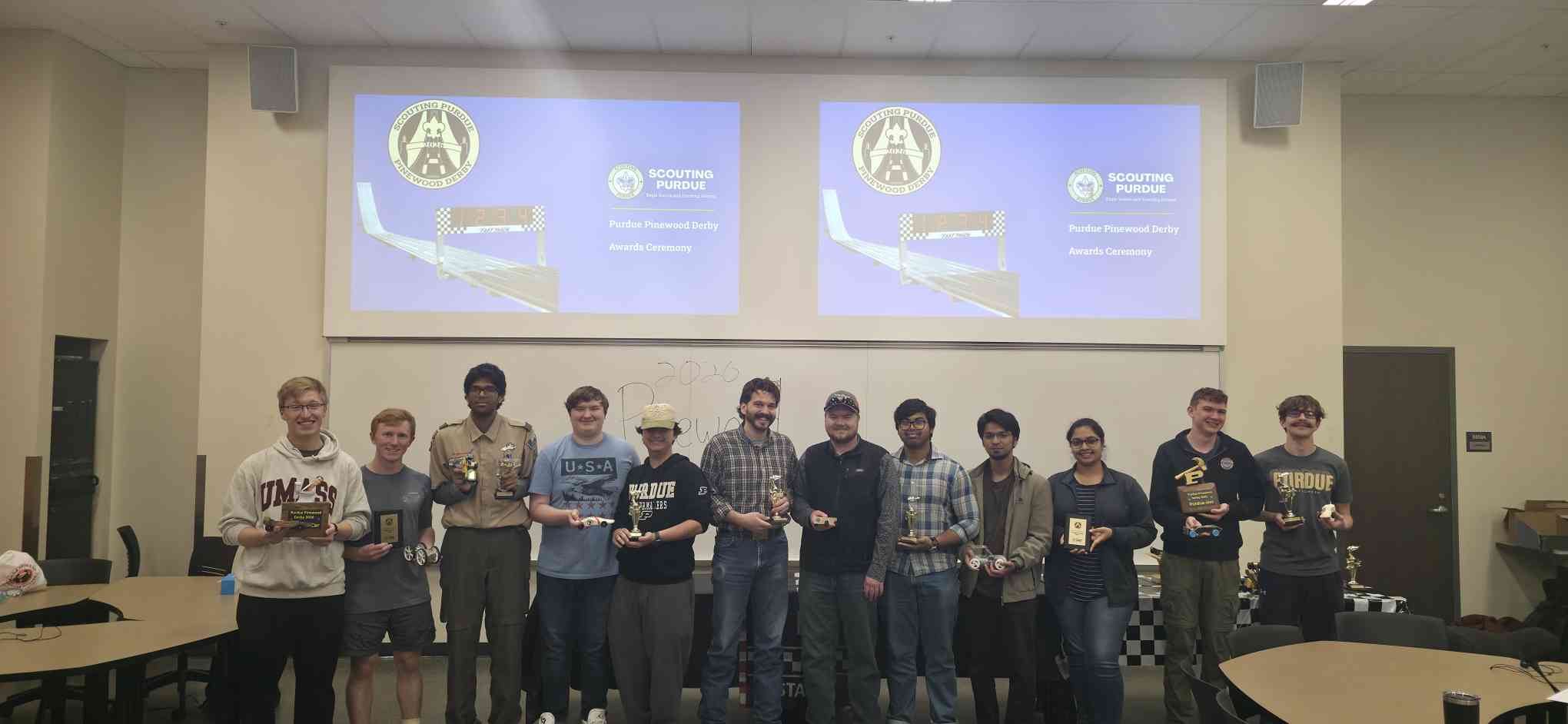 Group photo holding Pinewood Derby cars