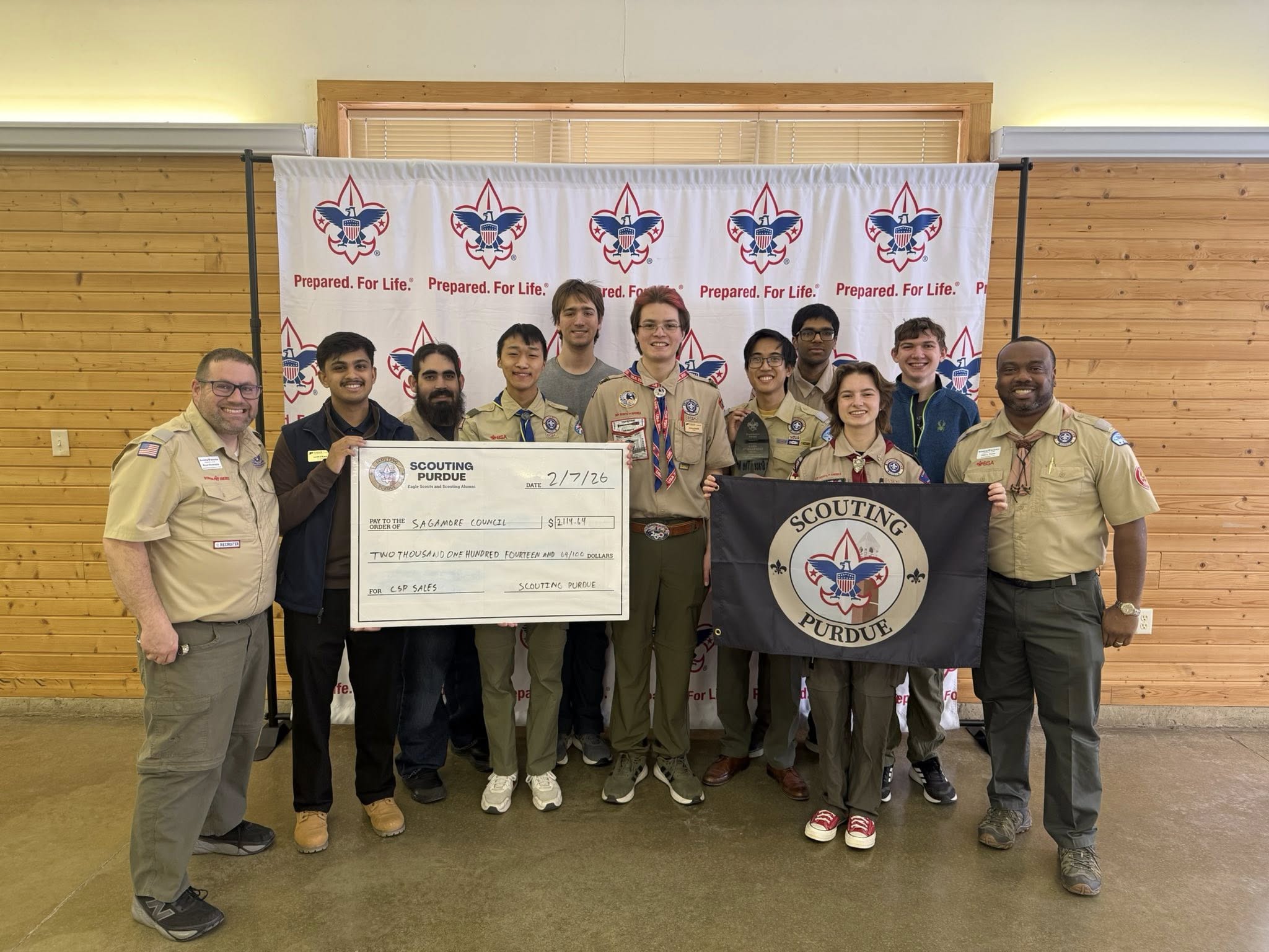 Group photo presenting check