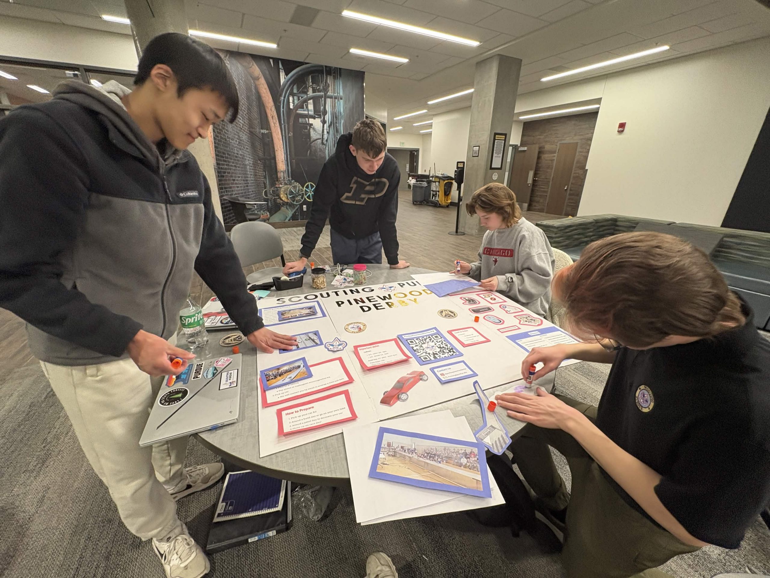 People working on poster board